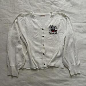 Axes Femme white cardigan with Alice in wonderland playing card crest patch